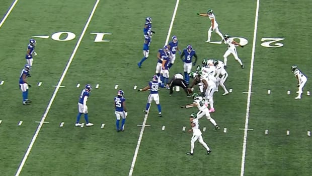 Jets line up to spike the ball against the Giants.